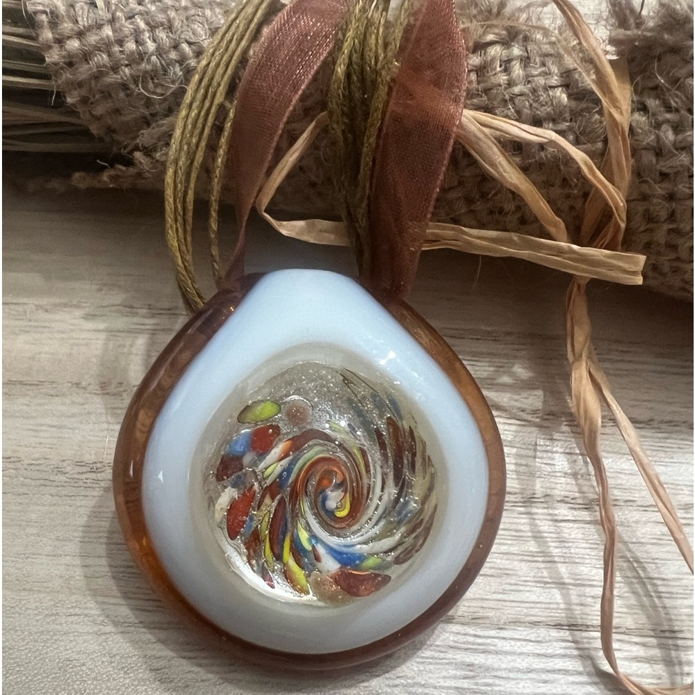 Excellent condition. Glass necklace with multi colors.